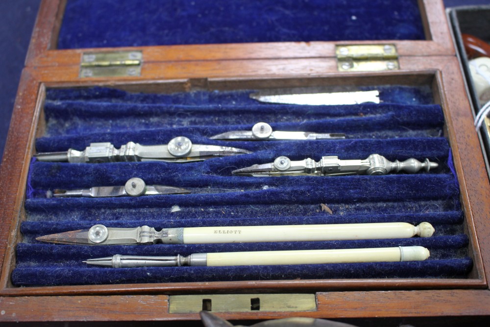 A wooden cased technical drawing set, signed Elliott, four pens, a desk seal and sundries